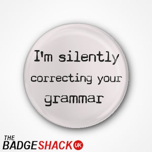 May include: White button with black text that reads "I'm silently correcting your grammar".