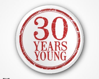 30 Years Young Pin Badge or Magnet. Available as a 2.5cm badge or a 3.8cm badge or magnet or needle minder