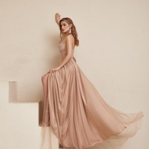 Blush Boho Wedding dress is perfect as a alternative wedding gown. Embroidered nude Corset with pink beads and fit and flare silk skirt covered with tulle. Prefect as a prom dress, evening dress or wedding guest outfit.