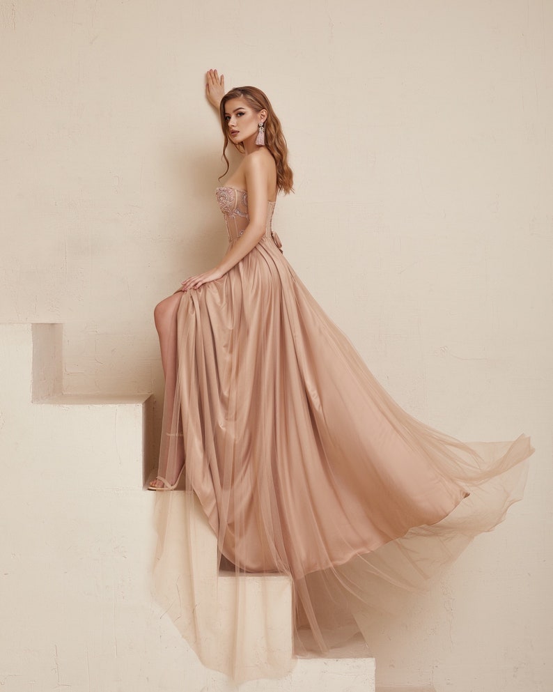 Blush Boho Wedding dress is perfect as a alternative wedding gown. Embroidered nude Corset with pink beads and fit and flare silk skirt covered with tulle. Prefect as a prom dress, evening dress or wedding guest outfit.