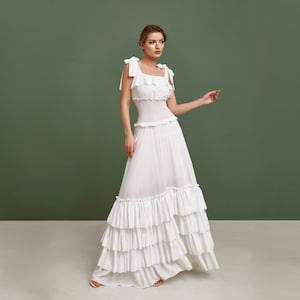 Beach wedding dress, simple white pinafore dress made from thin chiffon. Fit and flare silhouette. Great as a summer evening gown.