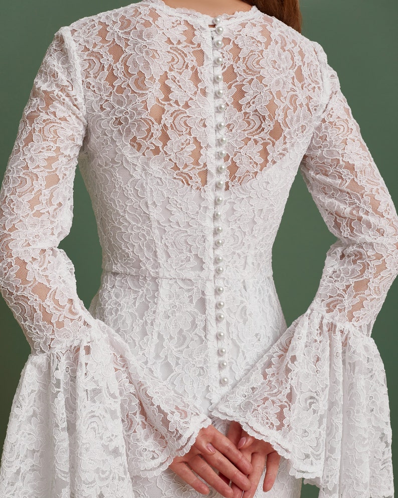 pearl buttons on the modest wedding dress back