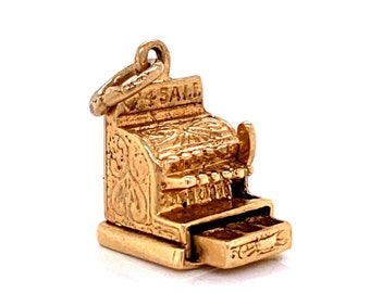 Gold With Black Print and Designs With Red Bottom Vintage Toy Cash Register Black and Red Plastic Handle Push Buttons to Raise Numbers.