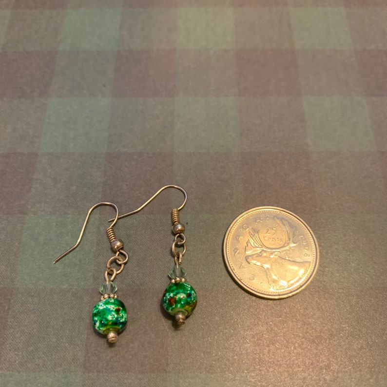 Glassed beaded earrings topped with a crystal