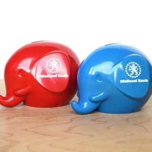 Two Vintage Midland Bank Elephant Money Boxes Red and Blue Plastic