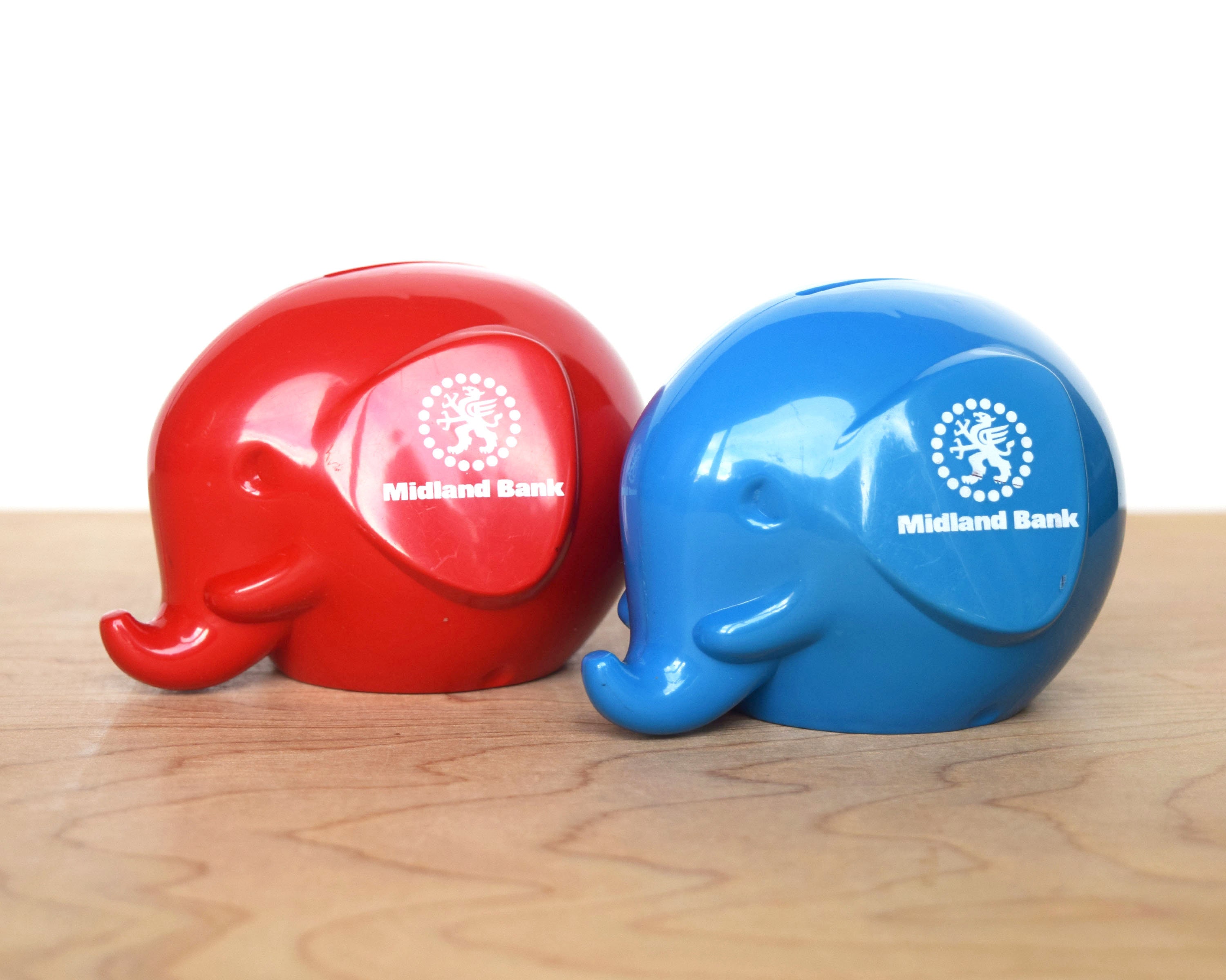 Two Vintage Midland Bank Elephant Money Boxes Red and Blue Plastic