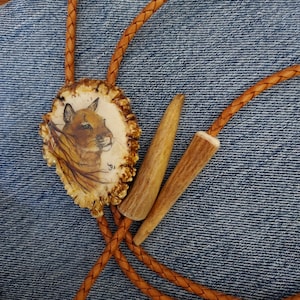 Hand-Painted Mountain Lion Bolo Tie: Elk Antler Burr, Braided Leather