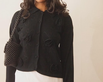 Cardigan nero in lana d'agnello degli anni '80 con applicazione a rosetta
