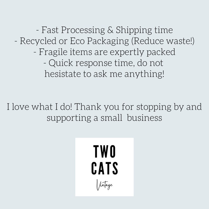May include: A white square with black text that reads "TWO CATS Vintage". The text is in a bold, sans-serif font. The text is centered on the square.