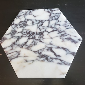 May include: A white hexagonal marble serving tray with a purple and grey marbling pattern.