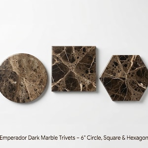 May include: Three Emperador dark marble trivets in circle, square, and hexagon shapes. Each piece features a polished brown surface with white veining. The text below reads: Emperador Dark Marble Trivets - 6" Circle, Square & Hexagon.