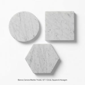 May include: Three Bianco Carrara marble trivets, each measuring 6 inches in diameter or width. The set includes one circular, one square, and one hexagonal piece, all featuring a white base with natural grey veining throughout the stone surfaces.