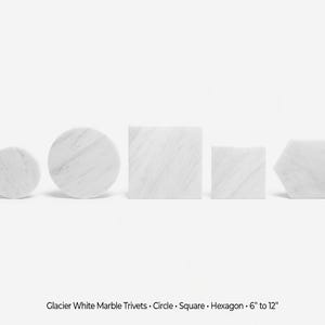 May include: Glacier white marble trivets in circle, square, and hexagon shapes. Sizes range from 15 cm to 30 cm. The marble features natural veining. These trivets add a touch of elegance to any kitchen or dining area.
