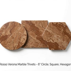 May include: Three Rosso Verona marble trivets in circle, square, and hexagon shapes. Each piece features a distinct reddish-brown veined pattern. The text below reads: Rosso Verona Marble Trivets - 6" Circle, Square, Hexagon.
