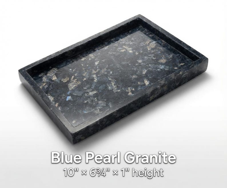 May include: A rectangular tray made of Blue Pearl granite with a polished surface featuring dark blue, black, and shimmering silver-grey mineral flecks. The tray measures 10 inches by 6.75 inches by 1 inch in height as stated in the text.