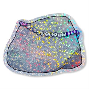 May include: A holographic sticker in the shape of a rock. A beaded bracelet with the text "KU4EVER" is wrapped around the rock. The bracelet has white, purple, and pink beads. The rock has a glittery, iridescent effect.