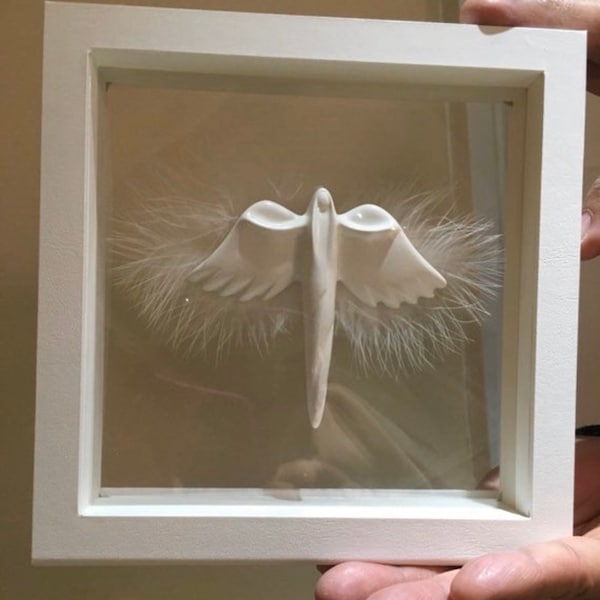 Angel of light in a frame handmade with love