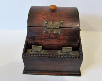 Antique wooden cigarette dispenser/box with roll top. 1930s.