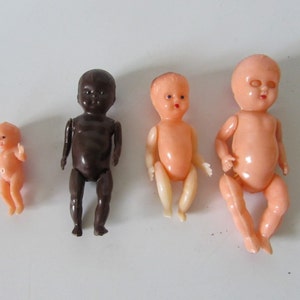 Collection Of Four Little Hard Plastic Dolls  /MEMsArtShop.