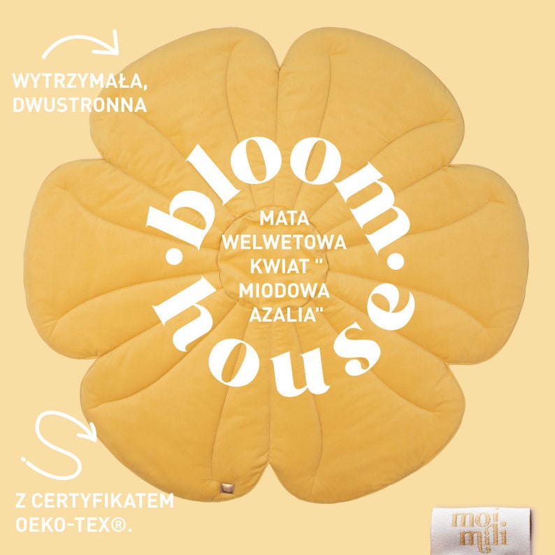 May include: A yellow flower-shaped play mat with the text "bloom.house" in a circle. The mat is made of velvet and has the text "MATA WELWETOWA KWIAT "MIODOWA AZALIA" in a smaller circle. The mat is labelled "WYTRZYMAŁA, DWUSTRONNA" and "Z CERTYFIKATEM Oeko-Tex&reg;".