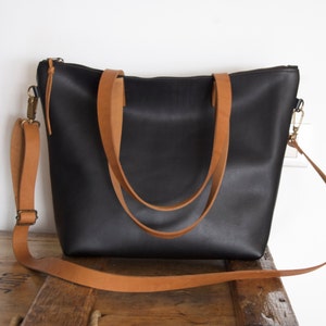 Black Leather bag with zip and brown leather straps. image 3