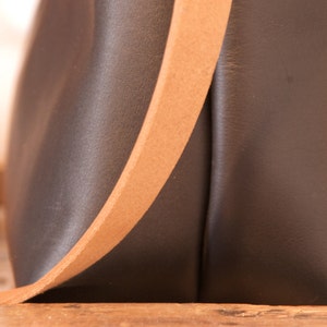 Black Leather bag with zip and brown leather straps. image 5