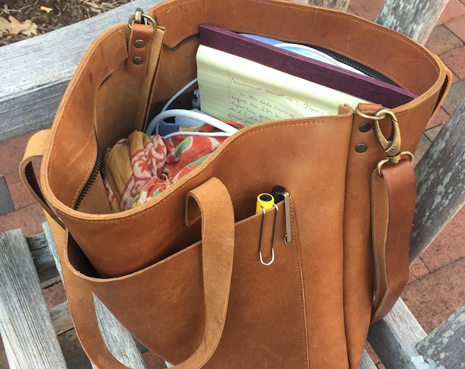 Camel leather bag with passementerie details
