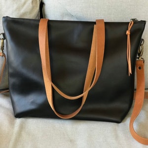 Black Leather bag with zip and brown leather straps. image 9