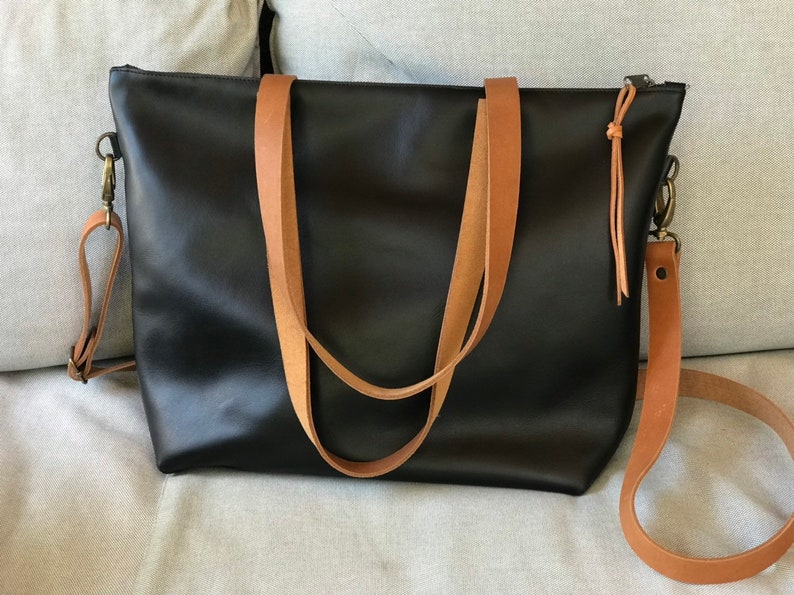 Black Leather bag with zip and brown leather straps. image 9