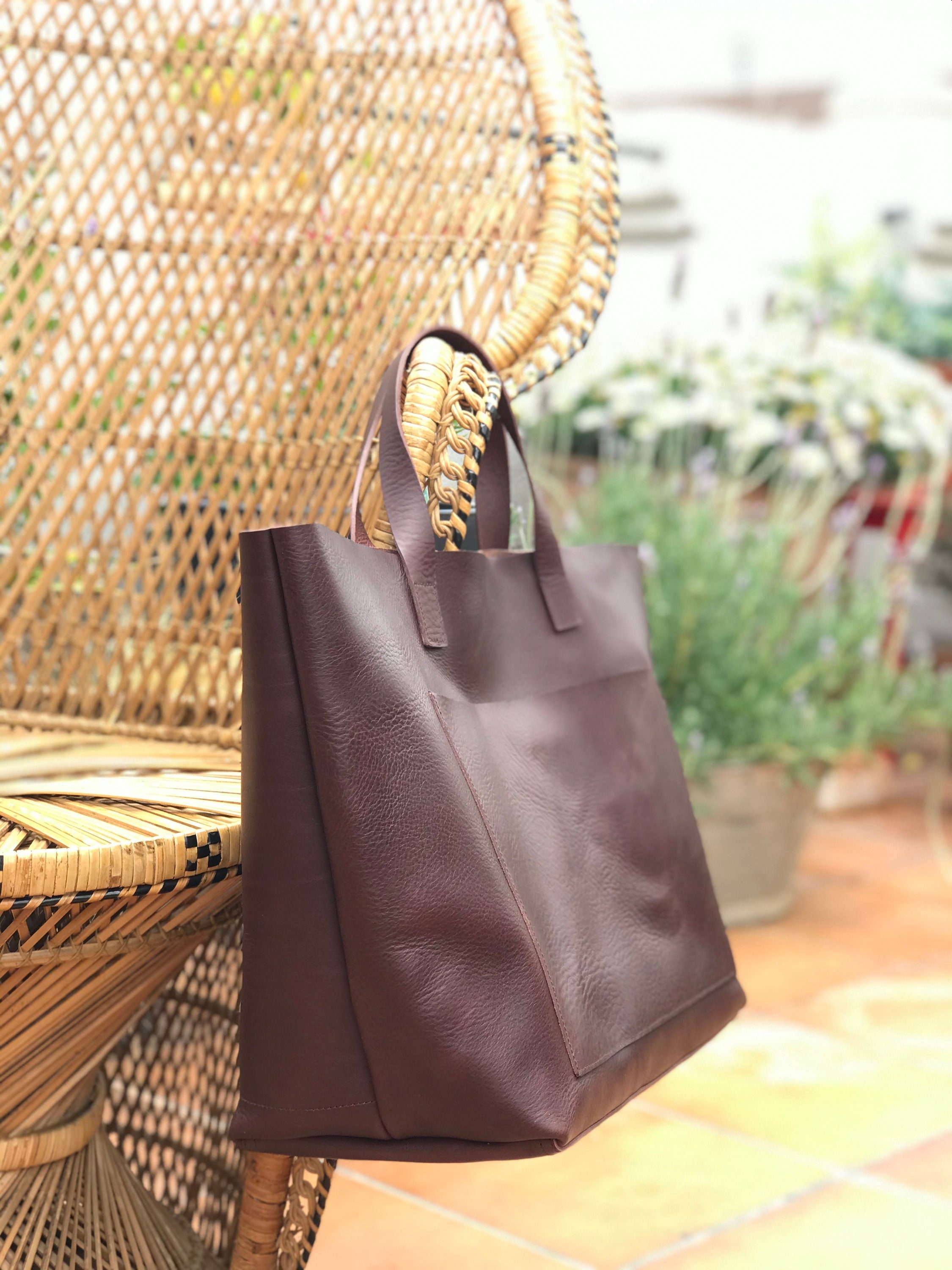 Oversized Cognac Leather tote bag with outside pockets. Cap Sa Sal
