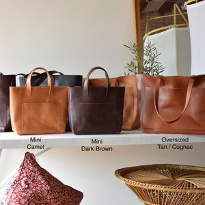 Oversized Cognac Leather tote bag with outside pockets. Cap Sa Sal