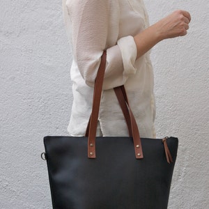 Black Leather bag with zip and brown leather straps. image 4