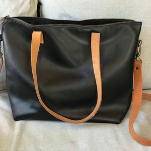 Black Leather bag with zip and brown leather straps. image 10