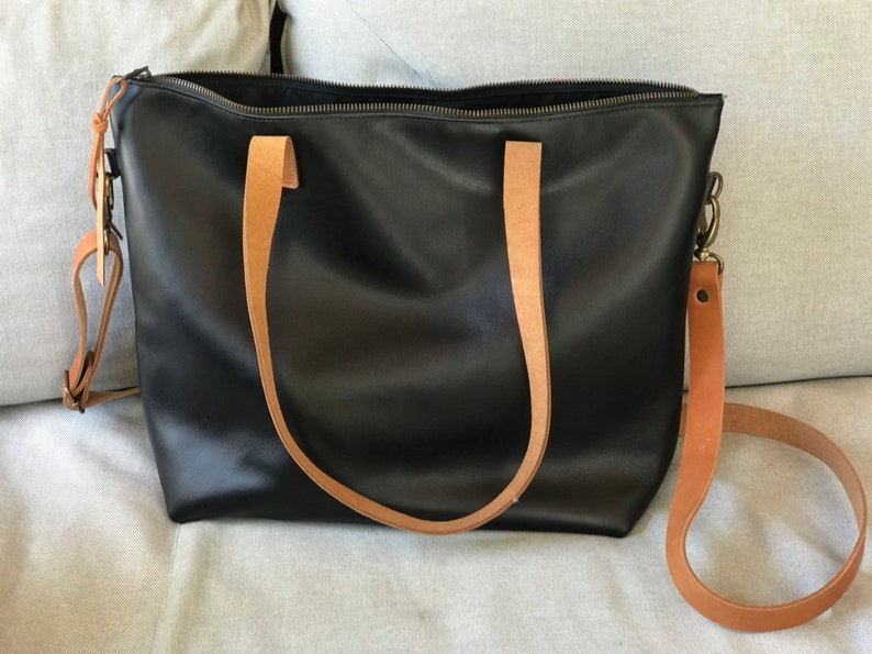 Black Leather bag with zip and brown leather straps. image 10