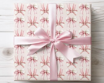 Papel de regalo con cinta rosa, un envoltorio dulce y elegante para cumpleaños, baby showers y paquetes bonitos.