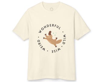 May include: A cream colored t-shirt with a brown platypus illustration and the text "Wonderful. Weird. Wise. Wild." in a circle around the platypus.