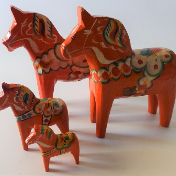 Family of 4 Vintage Swedish Dala Horses, 2 @ 5-1/8" H x 5-1/8" L (Original Nils Olsson Sticker), 1 @ 3" H x 2-3/4" L, 1 @ 2" H x 1-7/8" L