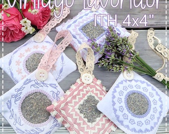 May include: Four white fabric sachets with lavender embroidery and a circle of dried lavender inside. The sachets are tied with lace ribbon and have a button on the front. The text "Vintage Lavender ITH 4x4" is at the top of the image.