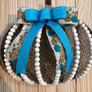 Wood bead and animal print pumpkin door hanger