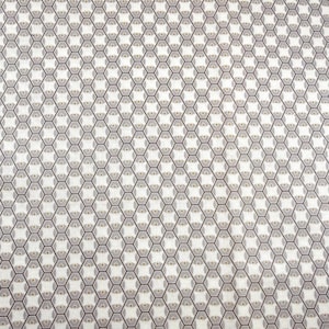 May include: A close-up of a fabric with a repeating geometric pattern. The design features a honeycomb-like structure with gray and gold accents on a white background. The pattern is evenly spaced and covers the entire surface.