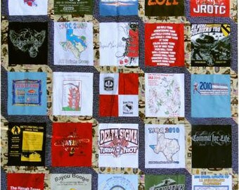 May include: A quilt made of various t-shirts, each with a different design and text. The t-shirts are arranged in a grid pattern, with each square containing a different design. Some of the designs include a dog, a turkey trot, a black hawk, and a map of Texas. The text on the t-shirts includes "Dogs of War", "Class of 2011", "JROTC", "Delta Sigma Turkey Trot", "Commit for Life", and "Black Hawk".