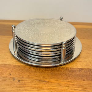 Vintage Silver Plate Coasters Set: Embossed Floral Design, Retro Barware