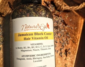 May include: A clear glass bottle with a black cap and label. The label reads "Nature's Ego", "Jamaican Black Castor Hair Vitamin Oil", "Vitamins: A, Biotin, B2, B6, B9, B12, C, D, E, Iron, Iodine, Magnesium, Niacin, Thiamin, Zinc", "Ayurvedic Ingredients: Fenugreek, Amla, Bhringraj, Sea Kelp, Cloves, Lavender", "mynaturesego.com", "4 oz (119 ml)".