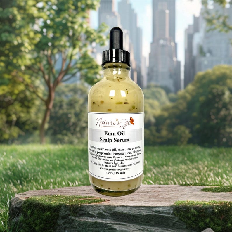 May include: A clear glass bottle with a dropper top filled with a yellow liquid. The bottle is labeled "Nature's Ego Emu Oil Scalp Serum" and lists the ingredients: distilled water, emu oil, msm, saw palmetto, rosemary, peppermint, horsetail root, cinnamon, and clove. The bottle is 4 oz (119 ml).