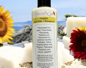 May include: A white bottle with a black pump dispenser labeled "Nature's Ego Organic Rice Milk + Fenugreek". The bottle lists ingredients including fermented rice water, shea butter, fenugreek, babassu oil, hempseed oil, sunflower lecithin, shikakai, amla, marshmallow root, brahmi, bhringraj, burdock root, cloves, and optiphen. The bottle is 8 oz (237 ml).