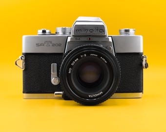 Vintage Minolta SRT 202 35 mm spiegelreflexcamera met Minolta MD 50 mm F2-lens