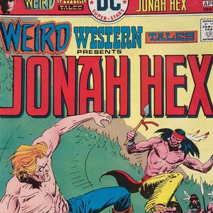May include: A comic book cover featuring Jonah Hex, a Western hero, in a fight with a Native American warrior. The cover is in the style of a Western comic book, with a bright yellow background and a red title.