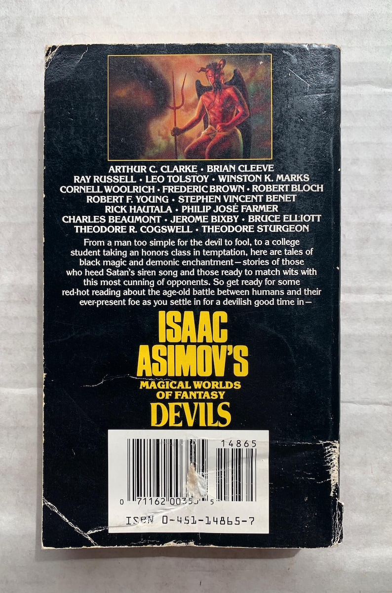 Może przedstawiać: Czarna i czerwona okładka książki z tytułem "Isaac Asimov's Magical Worlds of Fantasy Devils" i nazwiskiem autora w dużych, białych literach. Na okładce znajduje się czerwony diabeł z rogami i widłami siedzący na tronie.