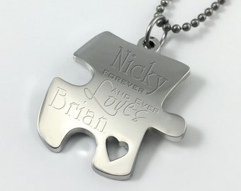 May include: Silver puzzle piece necklace with the text "Nicky Forever and Ever Loves Brian" engraved on it.