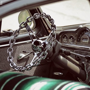 On Lock Photograph of a chain steering wheel on a vintage 1949 Pontiac Lowrider classic car photo photography Chicano Soul